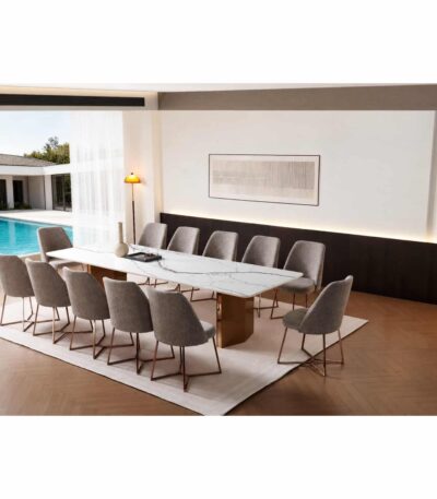 White marble-look sintered stone dining table with rose gold pillar legs