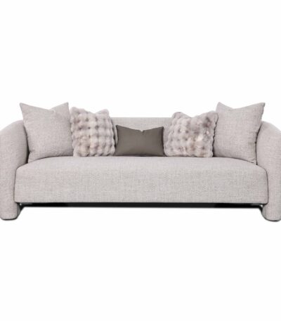 Warm grey textured fabric three-seater sofa with rolled arms and faux-fur scatter cushions