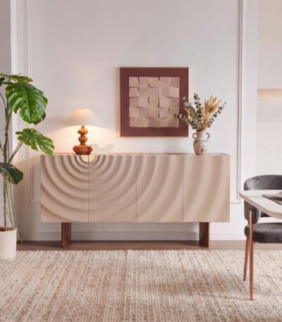 White marble-look sintered stone sideboard with wave-textured taupe doors and copper legs