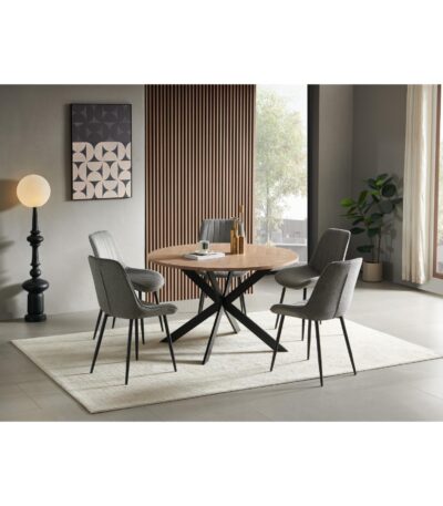Round wood-look dining table with black metal X-base and grey fabric chairs — view 2