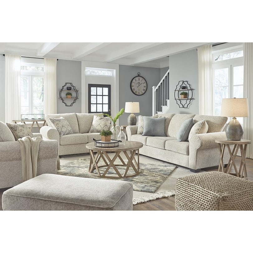 Warm oatmeal fabric sofa set with rolled arms and patterned scatter cushions