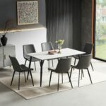 White marble-look rectangular dining table with six grey PU leather chairs on black metal legs