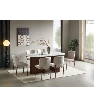 Oval white sintered stone dining table with fluted walnut pedestal base and six beige chairs