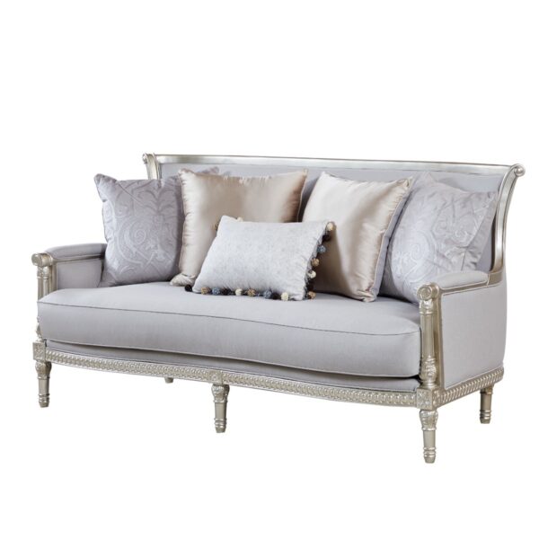 Dove grey fabric loveseat with carved silver frame and scatter cushions