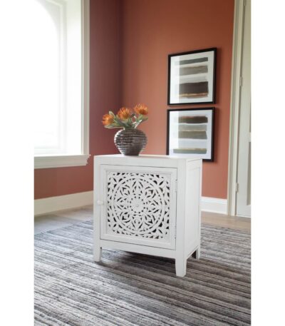 Antiqued White display cabinet with hand-carved medallion door and single interior shelf