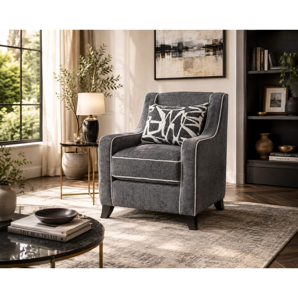 Charcoal grey chenille sofa chair with white piping and monochrome scatter cushion