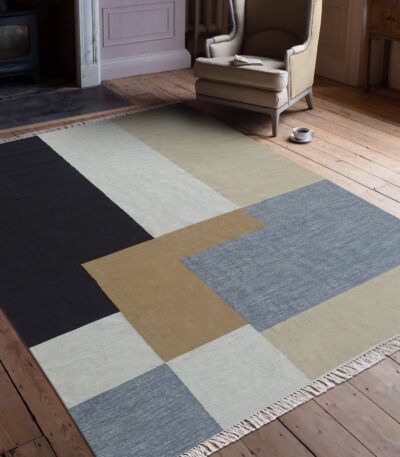 Handwoven cotton dhurry rug in black camel ivory and grey colour-block design