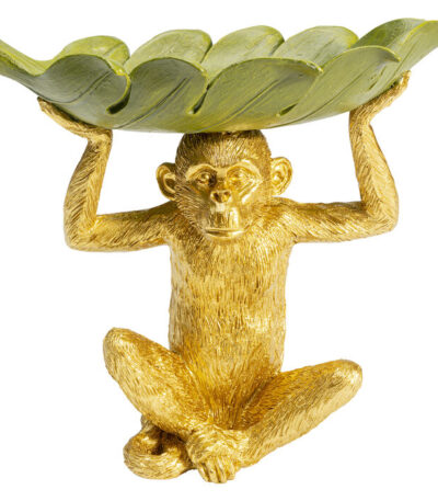 Gold polyresin monkey figurine holding a sage green banana leaf-shaped decorative bowl