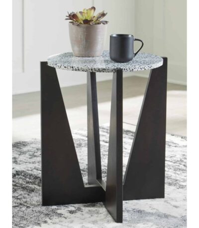 Round accent table with terrazzo-look top and dark wood cross-panel base