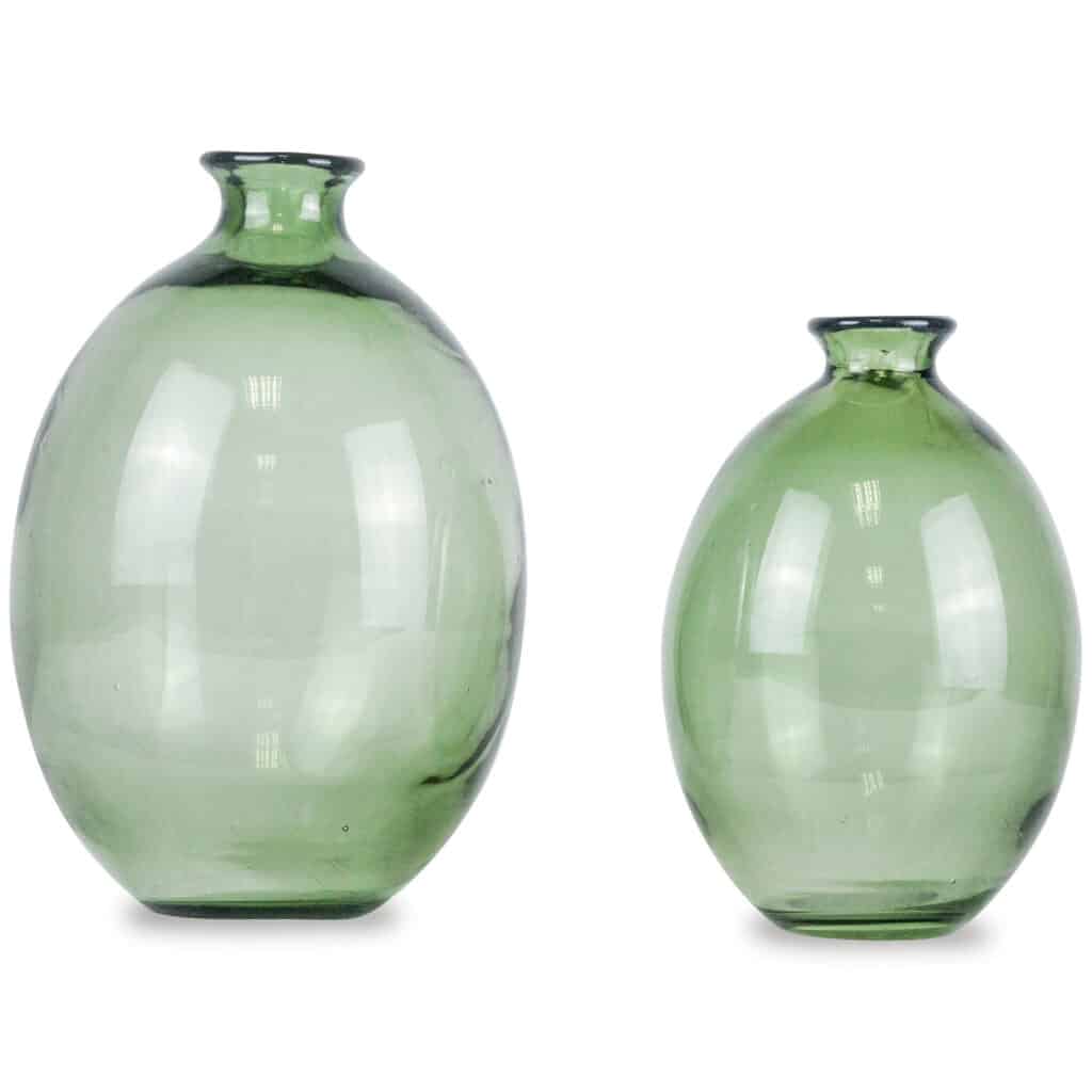 Set of two sage green glass vases with rounded bodies and flared necks