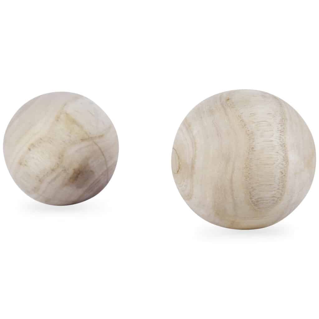 Set of three natural wood decorative balls with visible grain