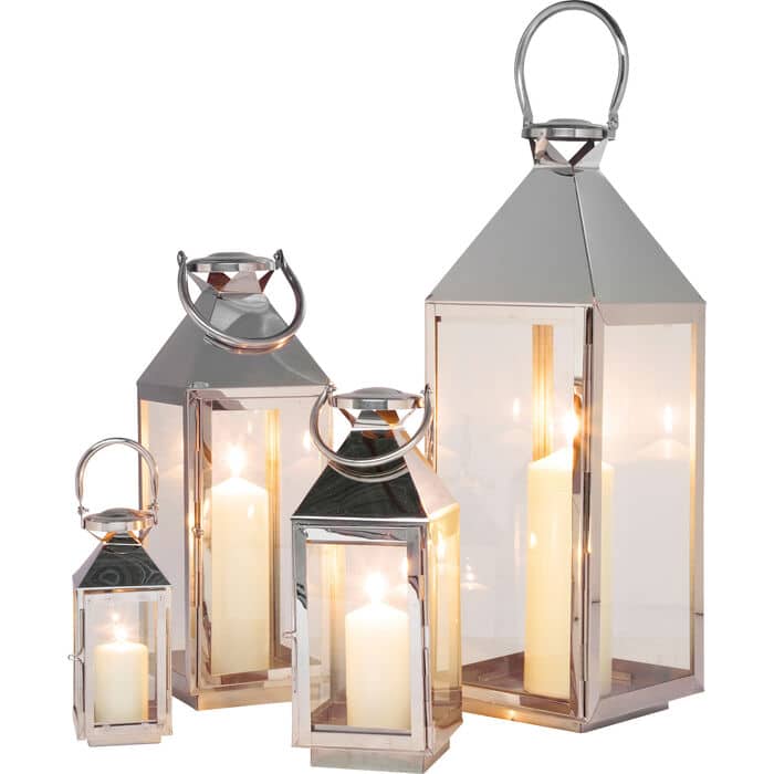 20-30-05811-1.jpg Set of four silver stainless steel glass lanterns with pyramid tops and candles