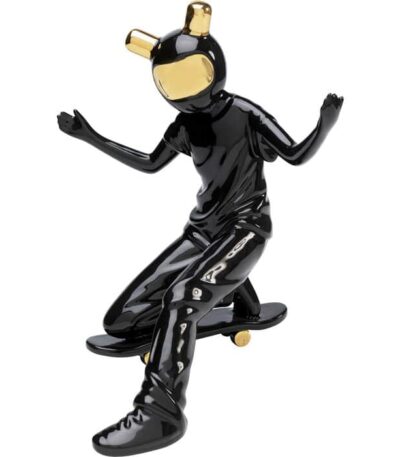 Glossy black ceramic astronaut figurine on skateboard with gold-tone helmet accents