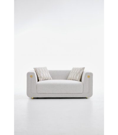 Warm ivory textured fabric loveseat with curved arms and gold accent detail