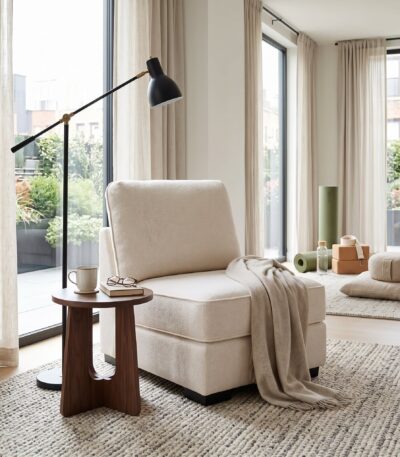 Warm ivory textured fabric armless sofa chair with deep seat and loose back pillow — view 2