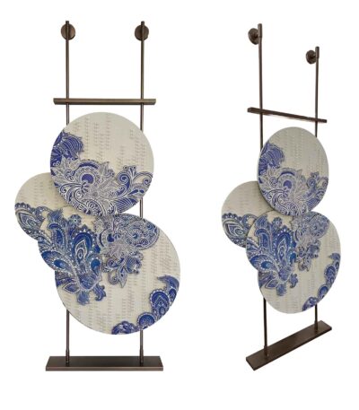 Freestanding 3D acrylic paisley panel in blue and ivory on a bronze metal stand